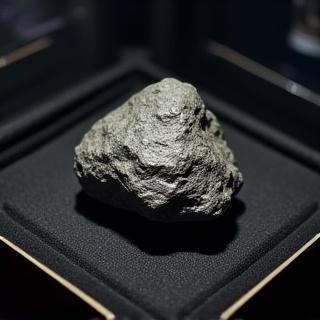 Authenticated meteorite in display case